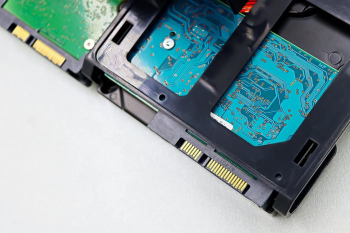 Detailed view of computer hard disk drive components, showcasing circuitry and connectors.