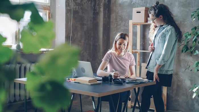 small business owner analyzing AI search visibility metrics on a digital dashboard