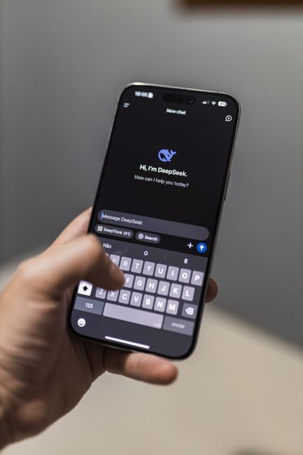 Close-up of a smartphone with an AI chat interface titled